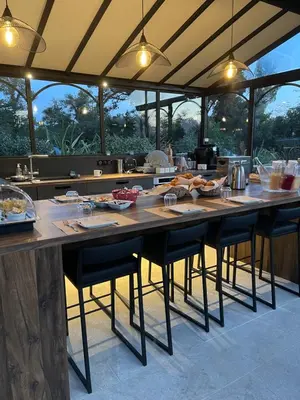 a kitchen with a large table with food on it at Château des Cinq Cantons in Carpentras