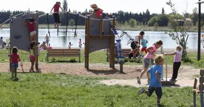 a group of children playing on a playground at Beau studio Monteux, balcon vue Lac, près de Spirou Provence in Monteux