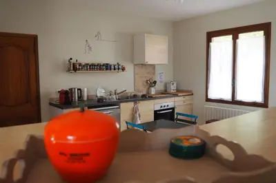 a kitchen with an orange ball on a table at Maison Le Grand Verger in Goult
