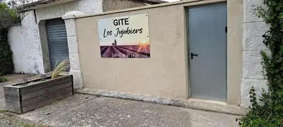 a building with a sign on the side of it at Gîte 