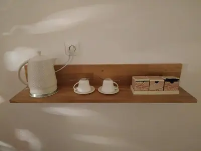 a wooden shelf with two dishes and a blender on it at La ferme des Escampades in Monteux