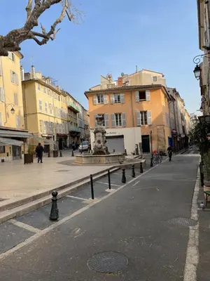 a living room with a couch and a table at Studio plein centre aix en Provence in Aix-en-Provence