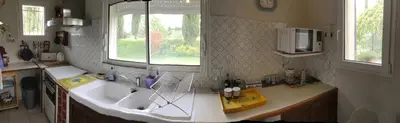 a kitchen with a sink and a window at le vieux pont in Carpentras