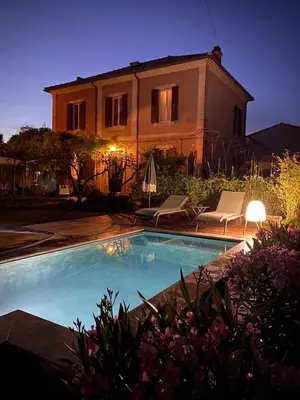 a house with a swimming pool in front of a house at La maison Gerval in Bédoin