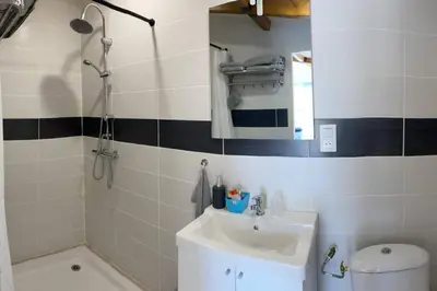 a bathroom with a sink and a mirror at Loft 21 m² pouvant accueillir 4 personnes in Monteux