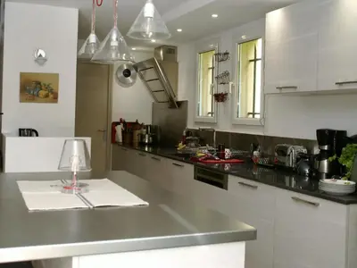 a kitchen with a counter with a lamp on it at Le Cezanne in Aix-en-Provence