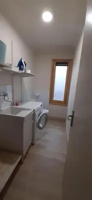 a bathroom with a sink and a toilet and a window at La maison de Gaston au cœur du Luberon in Villars