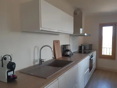 a kitchen with a sink and a counter top at La maison de Gaston au cœur du Luberon in Villars