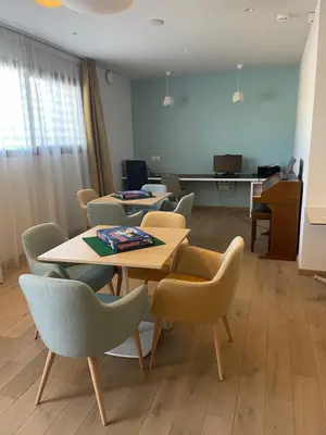 a dining room with a table and chairs at DOMITYS LES TOURMALINES in Carpentras