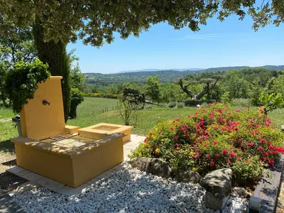 a garden with a toilet and flowers in a field at Location bastide provencale Luberon in Murs