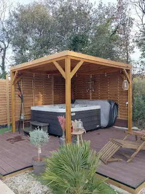 a wooden gazebo with a hot tub on a deck at Maison d'Hôtes & Spa La Chêneraie-Provence Ventoux in Saint-Didier