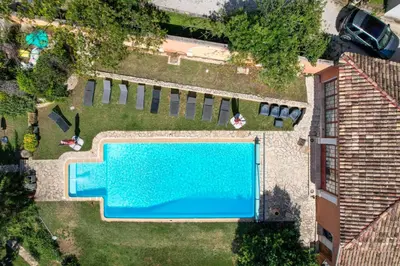 an overhead view of a swimming pool in a yard at La Petite Maison - Mas des Sous Bois in Ventabren