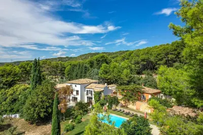 an aerial view of a house with a pool and trees at La Petite Maison - Mas des Sous Bois in Ventabren