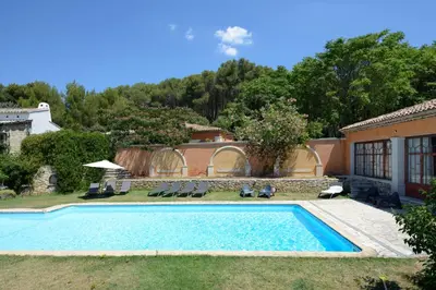 a swimming pool in the yard of a house at Le Pool House - Private Jacuzzi - Mas des Sous Bois in Ventabren