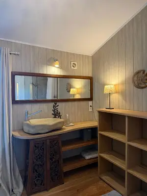 a shower with a glass door in a bathroom at La Source in Rustrel