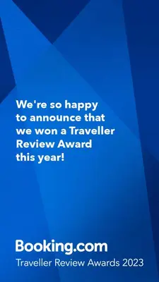 a blue sign that says were so happy to announce that we won a traveler at Le Domaine de Belle in LʼIsle-sur-la-Sorgue