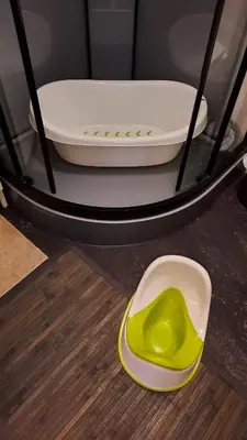 a green and white object sitting on top of a stove at La Maison du Chemin des Prairies in Morières-lès-Avignon