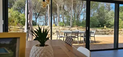 a dining room with a table and chairs on a patio at Villa la Provence, Luxe, Confort et Joie de Vivre in Carpentras