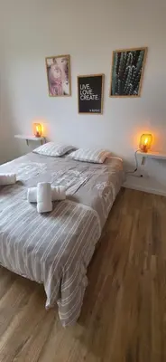 a bedroom with a large bed with two lights on it at Villa la Provence, Luxe, Confort et Joie de Vivre in Carpentras