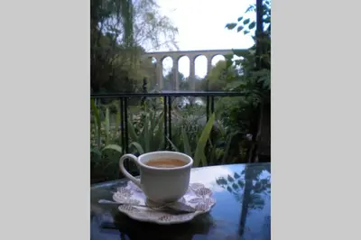 a cup of coffee sitting on a table at Appartement à FONTAINE DE VAUCLUSE in Fontaine-de-Vaucluse