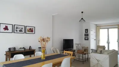 a dining room and living room with a table and chairs at Provence Luberon Goult Gite Mafasuza in Goult