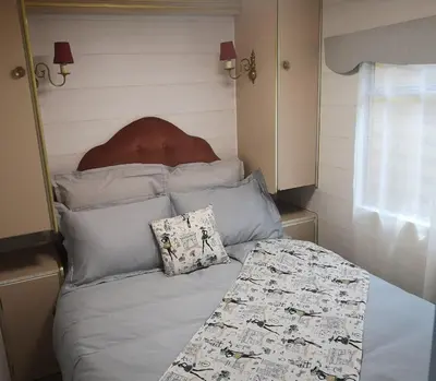 a bed with pillows and a headboard in a room at Interlude in Lambesc