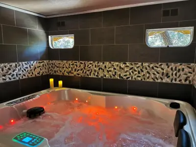a bath tub with red lights in a bathroom at Interlude in Lambesc