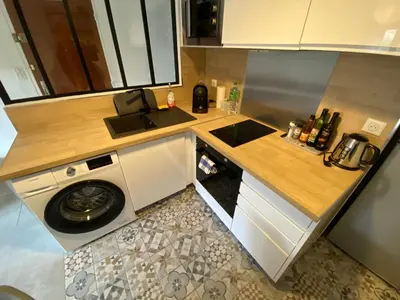 a small kitchen with a sink and a washing machine at Appartement T2 Cosy sur Aix in Aix-en-Provence