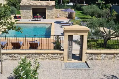 a house with a swimming pool and a house with a pool at Le Cabanon de Nans. Gîte de charme en Provence. in Grans