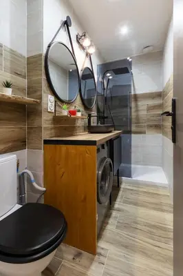 a bathroom with a toilet and a sink and a mirror at OPEN SKY Industry Hyper Centre Fontaine Moussue in Salon-de-Provence