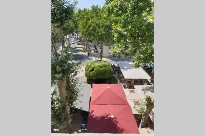 an overhead view of a street with a red umbrella at OPEN SKY Industry Hyper Centre Fontaine Moussue in Salon-de-Provence