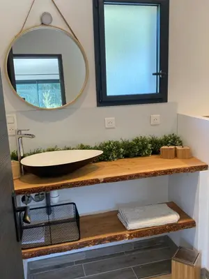a bathroom with a sink and a mirror at Petit nid douillet en Luberon avec spa in Ansouis