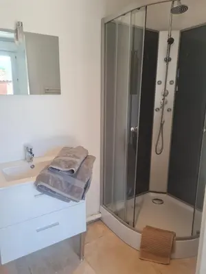 a bathroom with a shower and a sink at Tylyan in Le Thor
