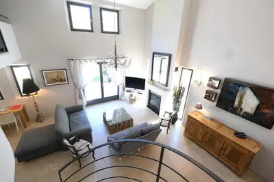 an overhead view of a living room with a tv at high standard provencal bastide with heated pool in lourmarin in the luberon, vaucluse. 10 people in Lourmarin