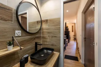 a bathroom with a black sink and a mirror at Bricks Industry Hyper Centre Fontaine Moussue in Salon-de-Provence