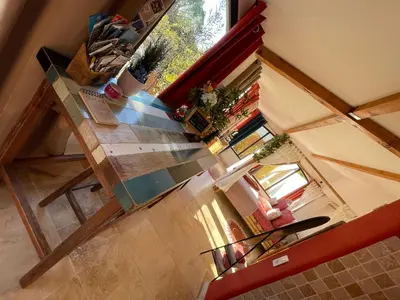 an overhead view of a table in a room with a surfboard at Mas de la Butte Blanche in Orgon