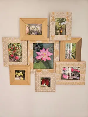 a group of framed pictures on a wall at Au pied du Massif des Costes in Pélissanne