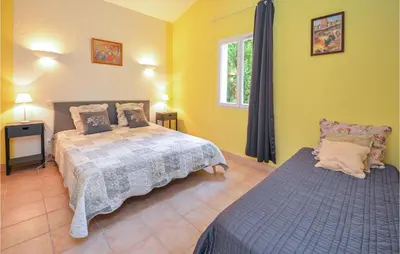a bedroom with a bed and a window at Cozy Home In Cabannes With Wifi in Cabannes