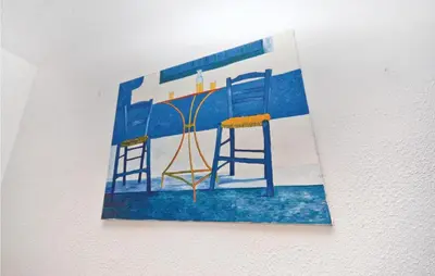 a painting of two chairs on a wall at Cozy Home In Aubignan in Aubignan
