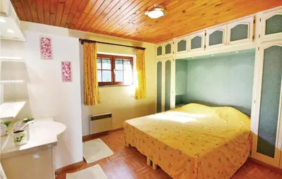 a bedroom with a bed and a sink in it at Cozy Home In Aubignan in Aubignan