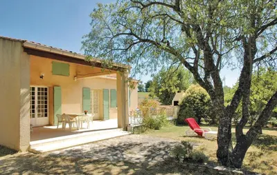 a house with a patio and a tree at 2 Bedroom Cozy Home In Saint Trinit in Sault-de-Vaucluse