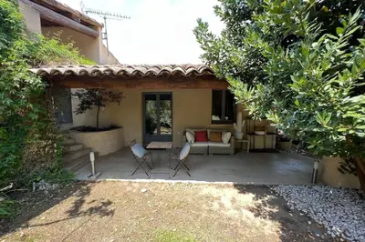 a patio with two chairs and a couch at Villa de 300 m au coeur du Luberon au calme sans in Maubec