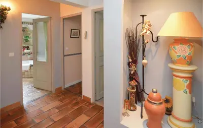 two pictures of a hallway with a lamp and a room at Amazing Home In Orgon in Orgon