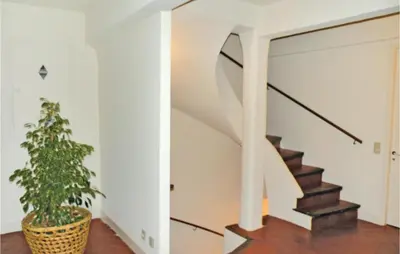 a staircase in a house with a potted plant at Nice Home In St Didier With Kitchen in Saint-Didier