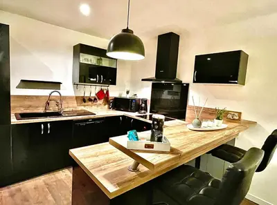 a kitchen with a wooden counter top and a sink at *FONTAINE MOUSSUE*HYPER CENTRE*T2 STANDING* in Salon-de-Provence