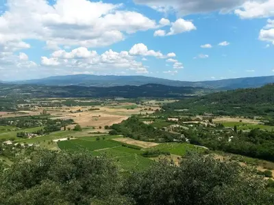 an aerial view of a field with mountains in the background at Holiday Home in Pertuis with Private Pool in Pertuis