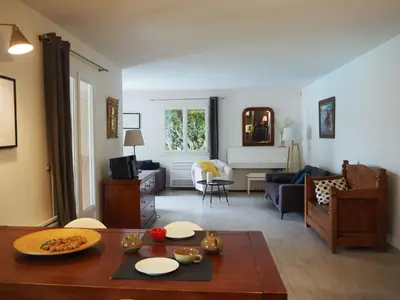 a living room with a table and a couch at Holiday Home in Pertuis with Private Pool in Pertuis