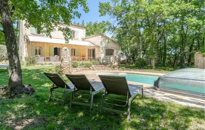 a group of chairs sitting next to a swimming pool at 4 Bedroom Pet Friendly Home In Apt in Apt