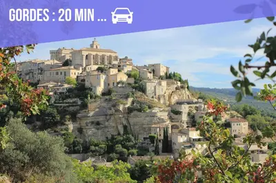 a village on a mountain with a van on top at Villa Piscine Chauffée & climatisation, 5min du village in Saint-Saturnin-les-Apt