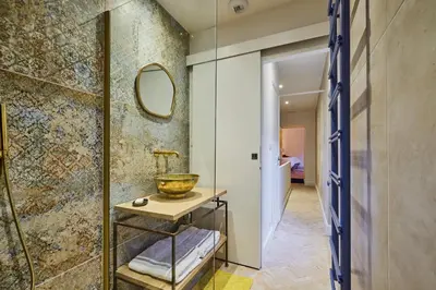 a bathroom with a sink and a mirror at Le Clos des Merveilles in Rognes